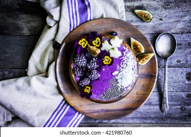 Purple Smoothie Bowl On Wooden Background