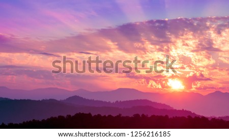 Purple sunset on mountains, dramatic sky, purple sunset in the nature