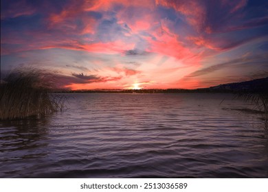 Purple sunset over the water and purple sky, taken from a boat. Natural landscape - Powered by Shutterstock