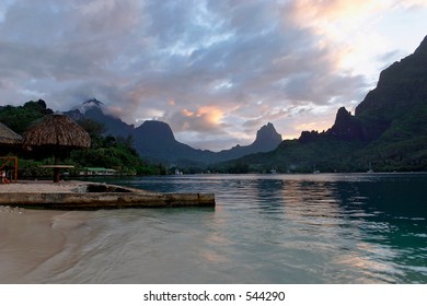 Purple Sunset With Water Reflections On Cooks Bay In Moorea, French Polynesia.