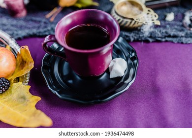 Purple Teacup on Jewel Tone Table for Spooky Halloween Decor