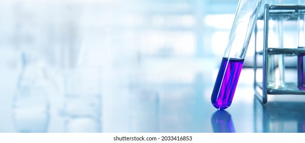 Purple Test Tube In Chemistry Science Research Lab White Blue Banner Background	