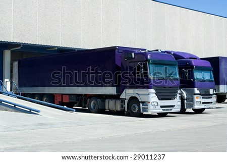 Purple Trucks Loading Goods at the Dock