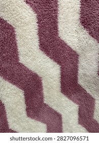 Purple white chevron pattern carpet texture soft zigzag fabric background