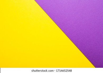 Purple and yellow paper as background. Two colored bright paper texture, top view with place for text - Shutterstock ID 1714652548