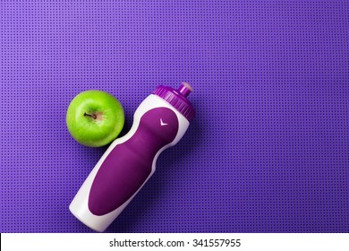 Purple Yoga Mat, Apple, Bottle Of Water