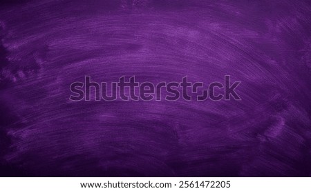 Purple-blackboard texture with empty space, offering a versatile background for teaching, creative work, or ads.