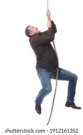 Purposeful Man Climbing The Rope. Isolated On A White Background.