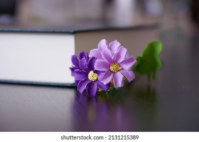 Purrle Flower On Hardcover Law Book In Blur Office Room For Business Or Education Background