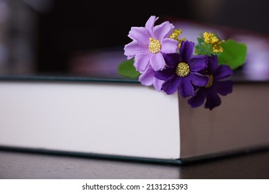 Purrle Flower On Hardcover Law Book In Blur Office Room For Business Or Education Background