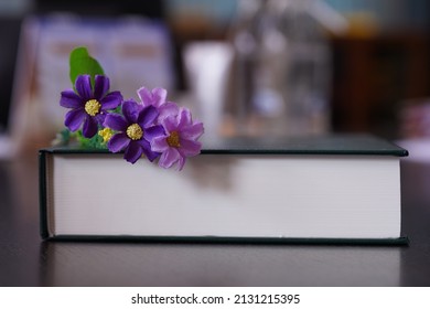 Purrle Flower On Hardcover Law Book In Blur Office Room For Business Or Education Background