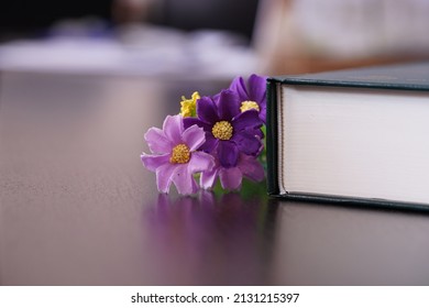 Purrle Flower On Hardcover Law Book In Blur Office Room For Business Or Education Background