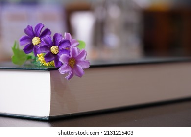 Purrle Flower On Hardcover Law Book In Blur Office Room For Business Or Education Background