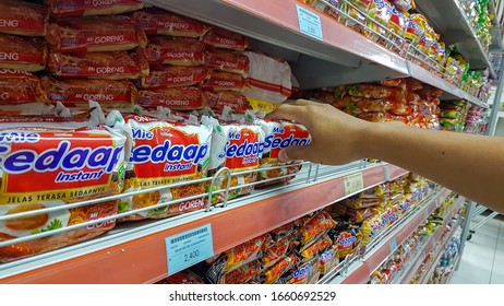 Purwakarta, 27 January 2020. Buyers Buy Instant Noodles On A Supermarket Shelf