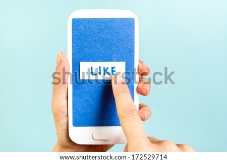 Push the blue like button on the phone concept