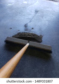 Push Broom With Pile Of Dirt