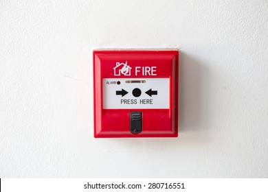 Push button switch fire alarm box on cement wall for warning and security system