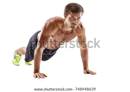 Push up fitness man doing push-up bodyweight exercise on gym floor. Athlete working out chest muscles strength training indoors