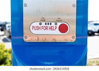 Push for help button on a metallic pole near a medical hospital