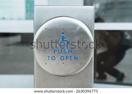 Push to open button for people. Push to open button for handicapped people.