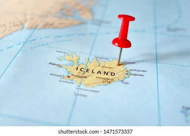 Push pin on the territory of Iceland on the world map