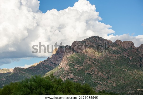 Push Ridge along the western edge of the Catalina\
Mountains in the Coronado National Forest north of Tucson. Monsoon\
storm clouds build behind a towering wall of rock. Pima County,\
Arizona, USA.