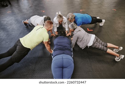 Push up, class and senior people in fitness group or circle for workout, training and community support. Exercise club, gym and lose weight of elderly friends with teamwork, sports goals and health - Powered by Shutterstock