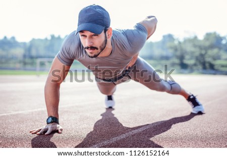 Similar – Jogger stretching in the morning on seaside.