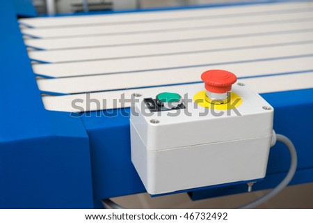 Pushbutton of the conveyor in a warehouse