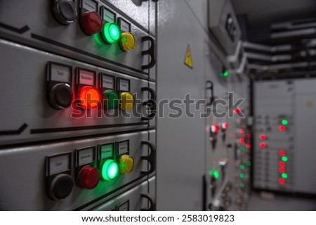 Pushbuttons and switches on the control panel of industrial equipment. Selective focus.