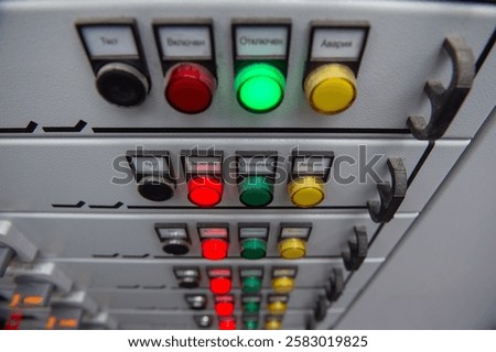 Pushbuttons and switches on the control panel of industrial equipment. View from the top.