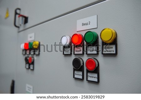 Pushbuttons and switches on the control panel of industrial equipment. Selective focus.