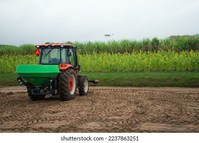 Pushcart or tractor truck is rotary tillers for excavator in the farm for gardening with sunlight and tree background at the plantation agriculture. - Shutterstock ID 2237863251