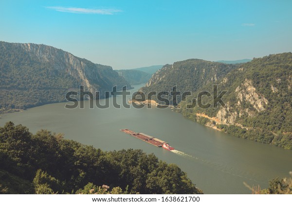 Pusher\
craft or pusher boat pushing barges or car floats on danube river\
shipping transportation on Rhine-Main-Danube\
Canal