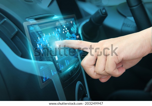 Pushing on car screen interface, With
driver entering an address into the navigation
system