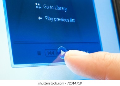 pushing play button on touch screen device