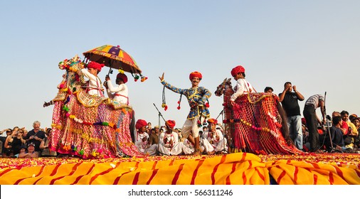 PUSHKAR, INDIA - MAR 7, 2012. Rajasthani folk dancers in colorful ethnic attire perform in Pushkar, India. Pushkar is one of the most ancient cities of India.