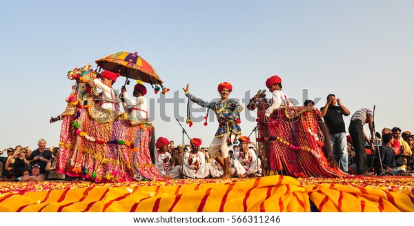 PUSHKAR, INDIA - MAR 7, 2012.\
Rajasthani folk dancers in colorful ethnic attire perform in\
Pushkar, India. Pushkar is one of the most ancient cities of\
India.