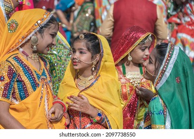 Pushkar, India - Nov 16, 2018 : Indian girls wearing traditional Rajasthani dress participate in Desert Festival in Pushkar, Rajasthan, India