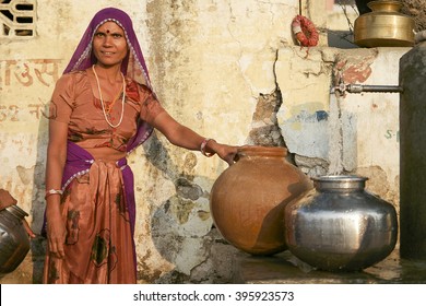 Pushkar, India-November 23, 2015:Unidentified Local Indian Women Pose For Camera In Water Collecting Center. Many Parts Of Urban India Are Experiencing Acute Water Shortage As Cities Expand Rapidly.