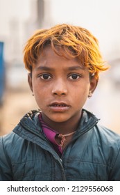 Pushkar, Rajasthan - India- January 20 2022 : A Close Up Portrait Of A Young Kid With Colored Hair And Captured In Shallow Depth Of Field.