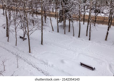 Pushkino, Russia, April 3, 2022. View Of The Boulevard Covered By An Unexpected Snowfall. Weather Anomaly.