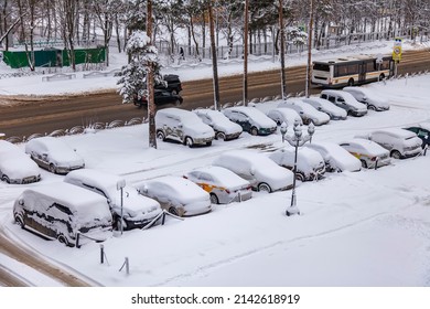 Pushkino, Russia, April 3, 2022. View Of The Street And Parking Covered By An Unexpected Snowfall. Weather Anomaly.