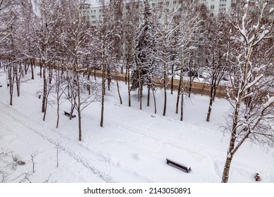 Pushkino, Russia, April 3, 2022. View Of The Boulevard Covered By An Unexpected Snowfall. Weather Anomaly.