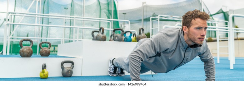 Pushup Fitness Man Exercising In Outdoor Gym Doing Workout Push Up Banner Panorama. Young Healthy Male Athlete.