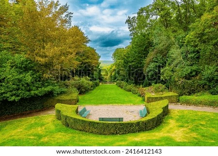 The“possession of Puss in Boots”. Beautiful park surrounds the ancient castle of Breteuil. Perfectly trimmed grass lawns of an autumn park. France