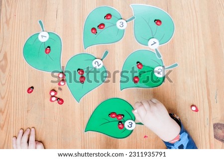 put correct amount of ladybug on assigned tree leaf. baby playing counting game. preschool educational aid for kindergartens. children early learning montessori kit for intelligence and development
