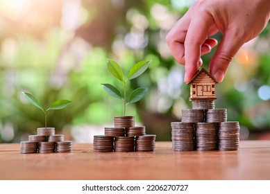 put house model on money coins saving for concept investment mortgage finance and home loan refinance - Shutterstock ID 2206270727