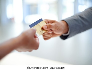 Put It On My Business Account.... Closeup Cropped Image Of A Man Handing Over A Credit Card To A Woman.