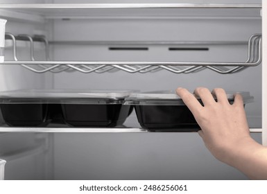 Put a plastic container with dinner in the fridge to reheat the next day, catering